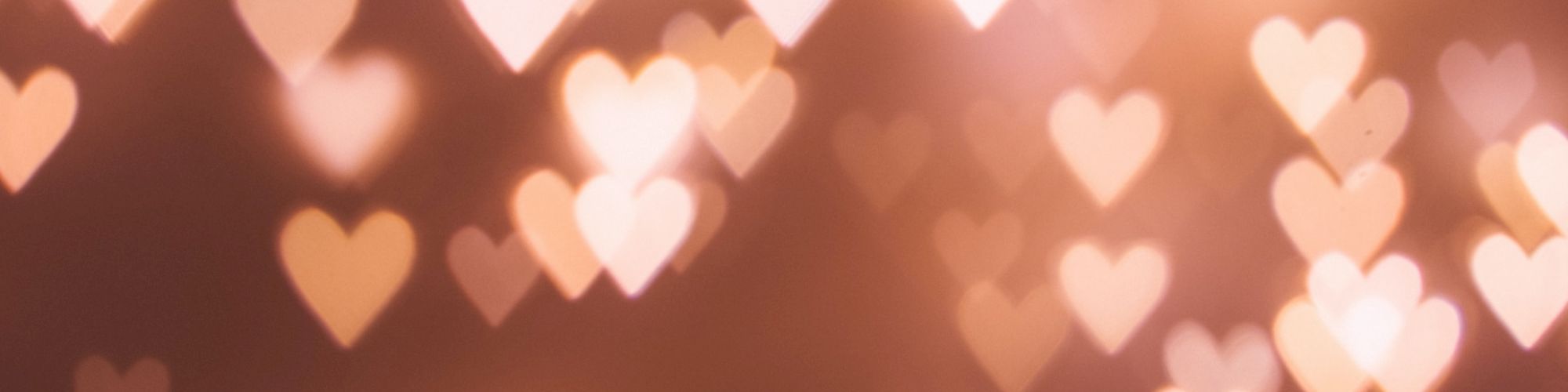 It's an image of heart-shaped bokeh lights, creating a romantic or festive atmosphere.