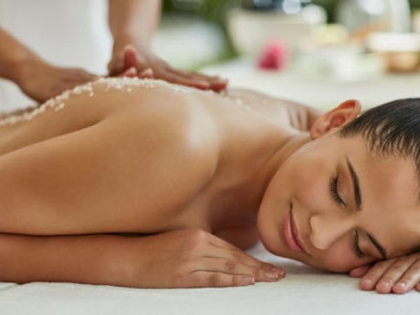 A person is receiving a spa treatment with a massage.